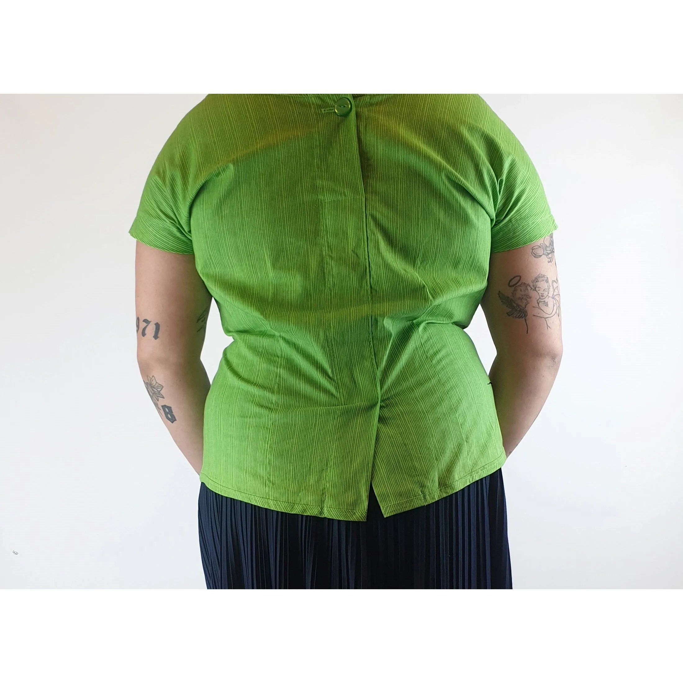Cute green top with virtical darker green stripes fits size 14