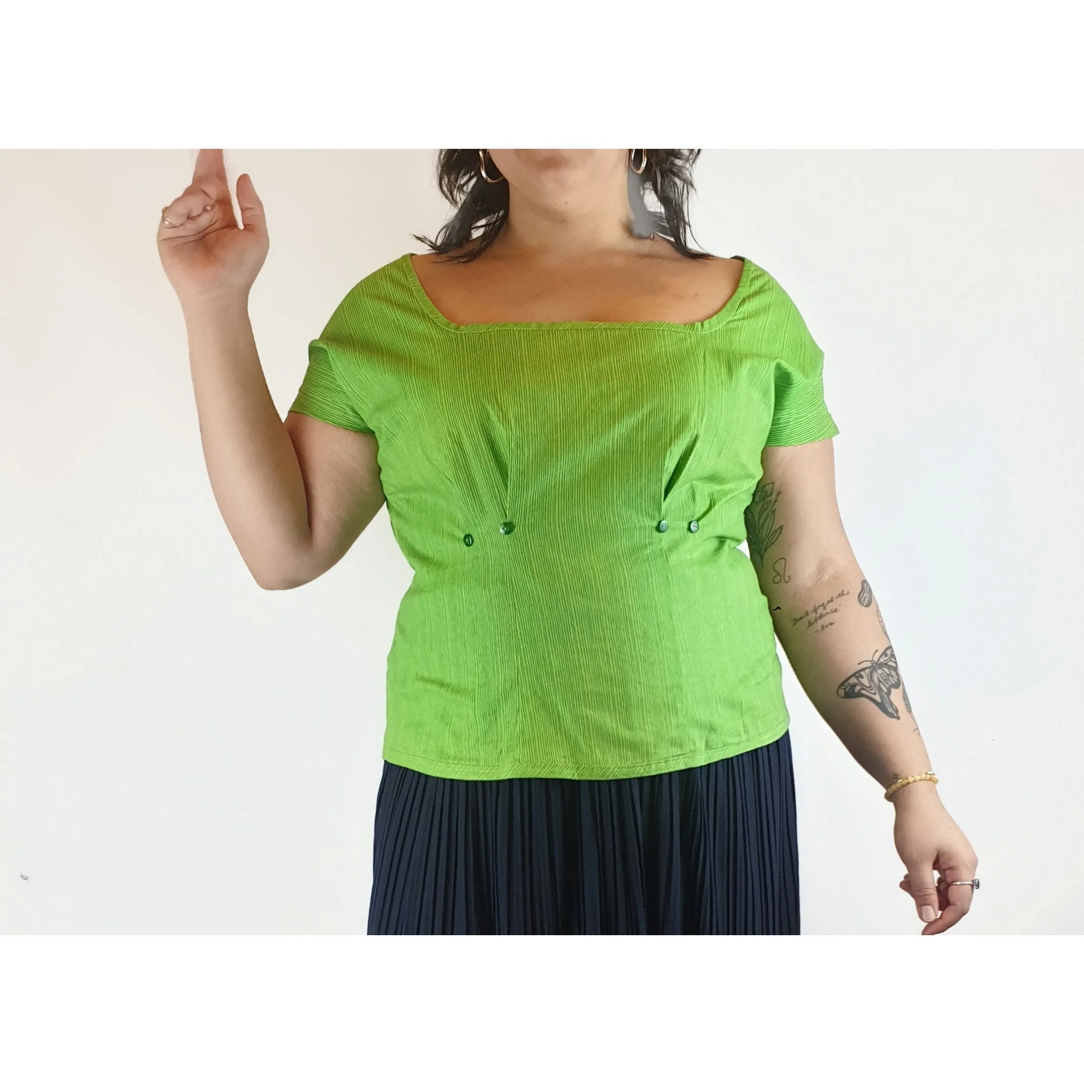 Cute green top with virtical darker green stripes fits size 14