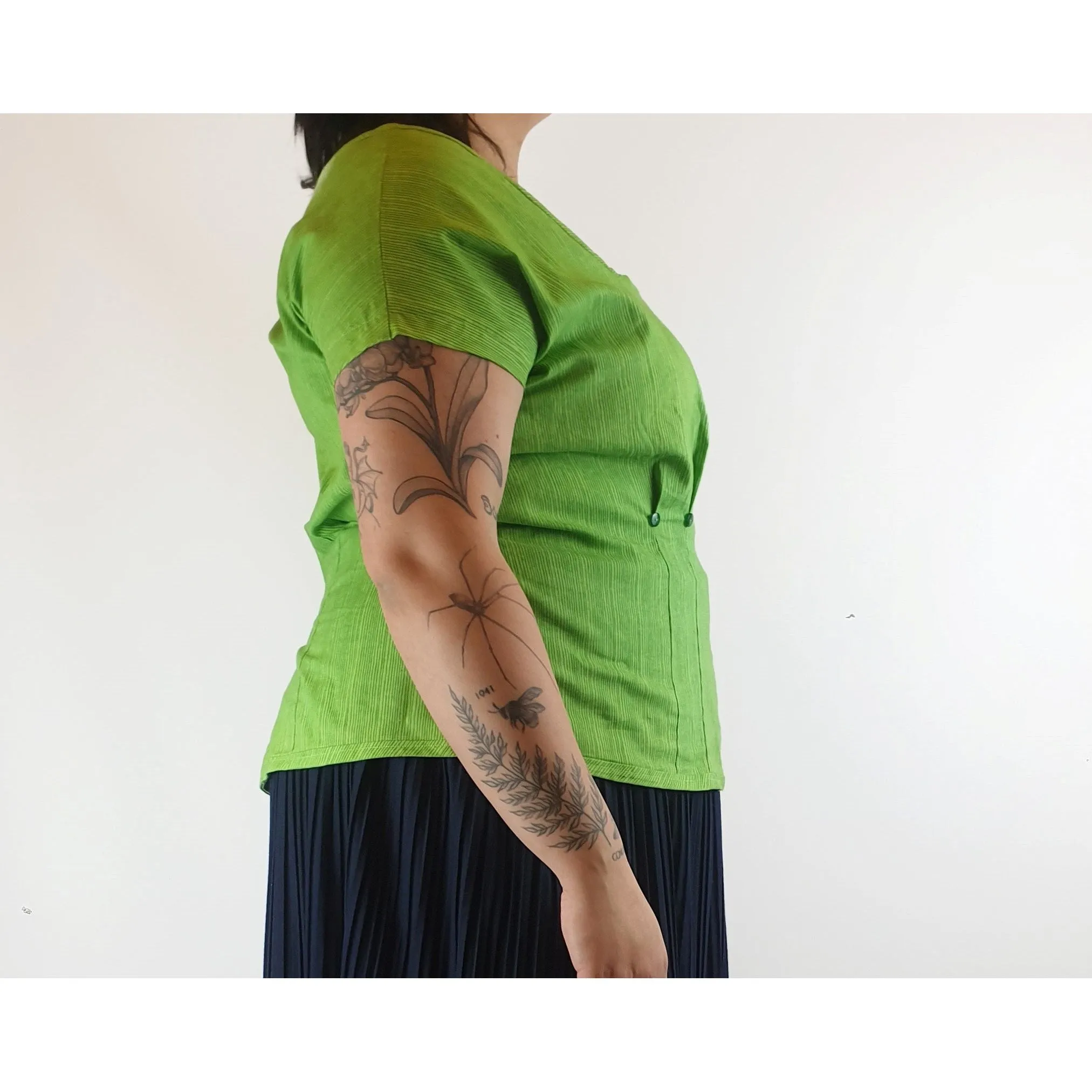 Cute green top with virtical darker green stripes fits size 14