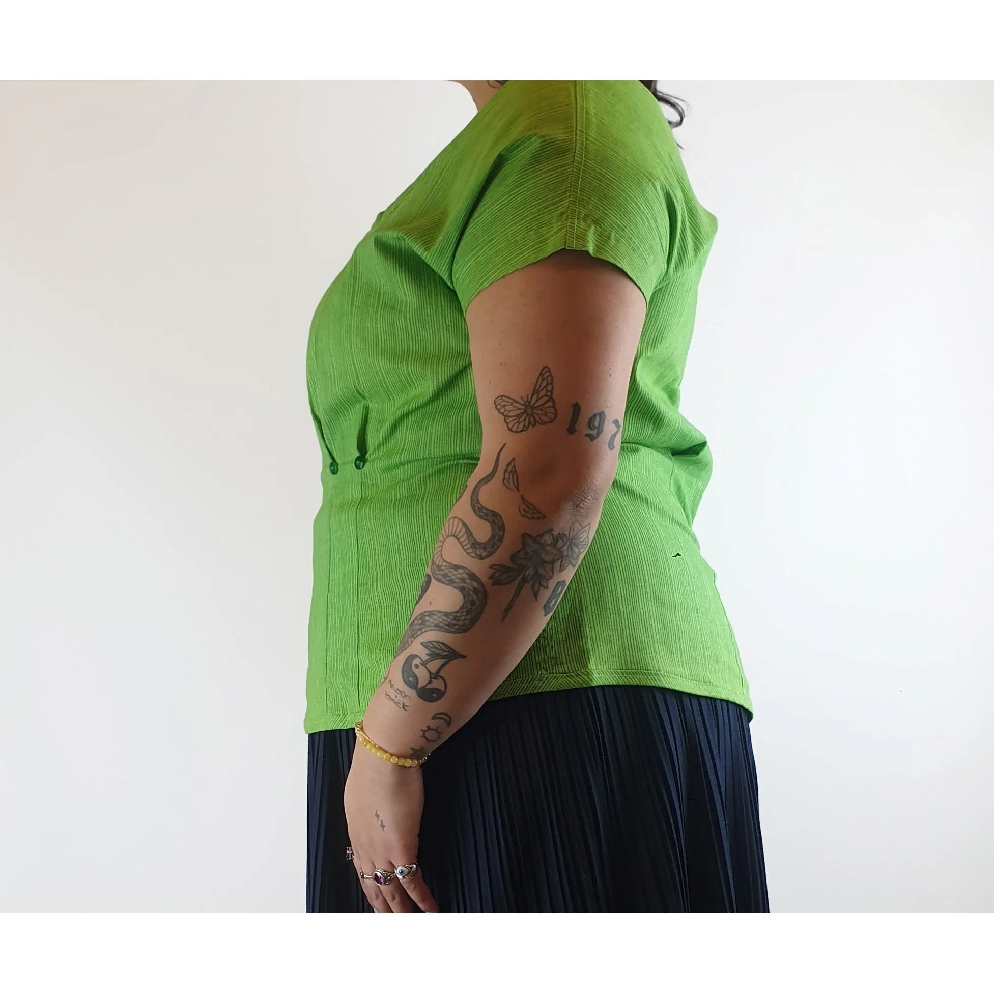 Cute green top with virtical darker green stripes fits size 14
