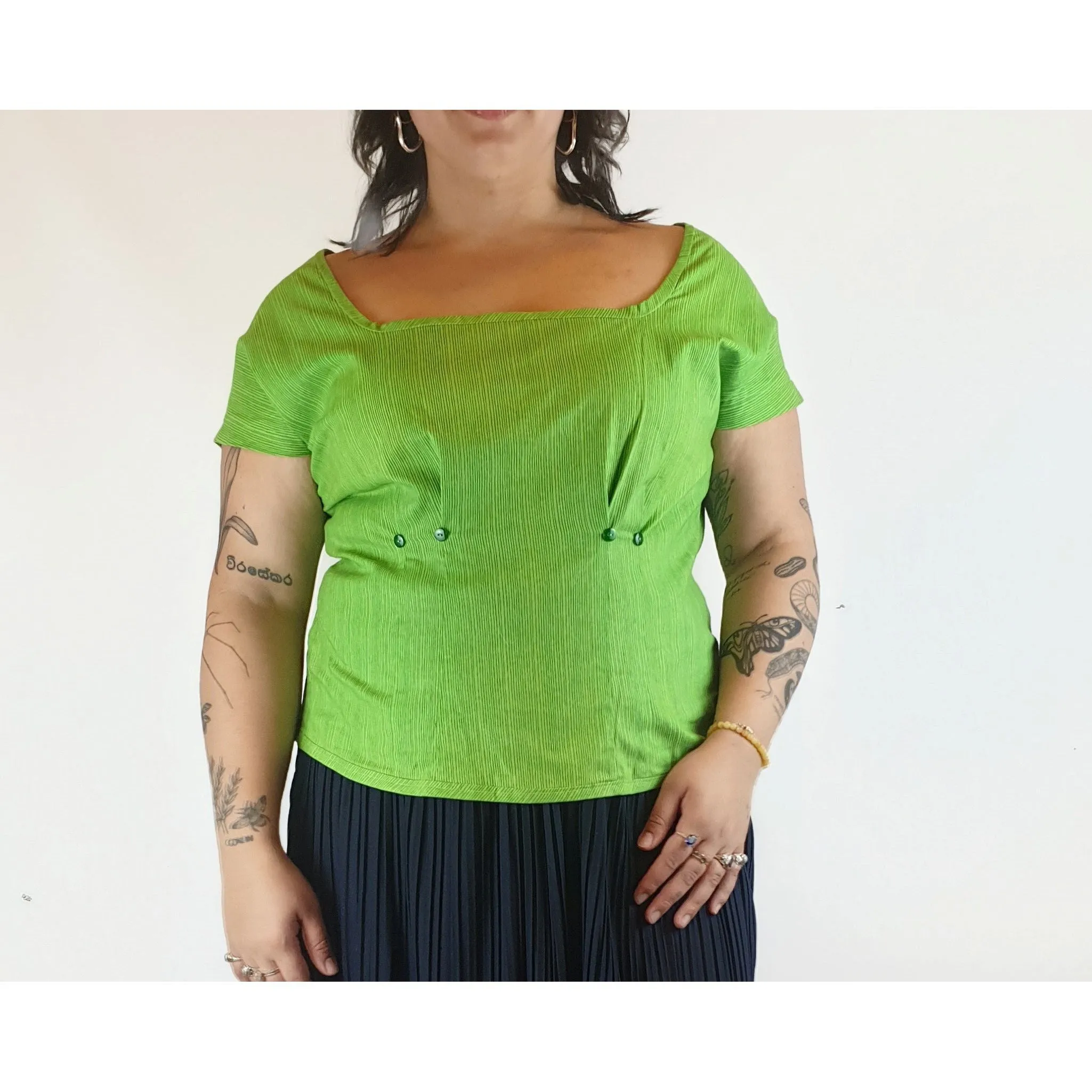 Cute green top with virtical darker green stripes fits size 14