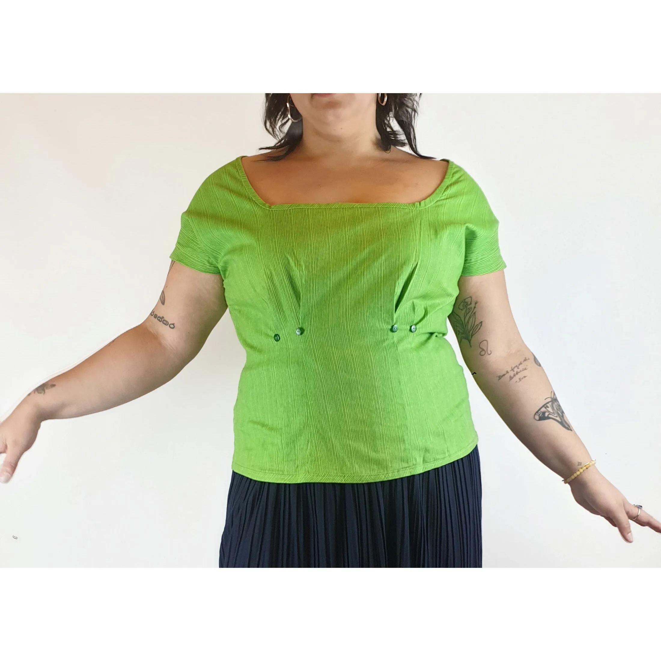 Cute green top with virtical darker green stripes fits size 14